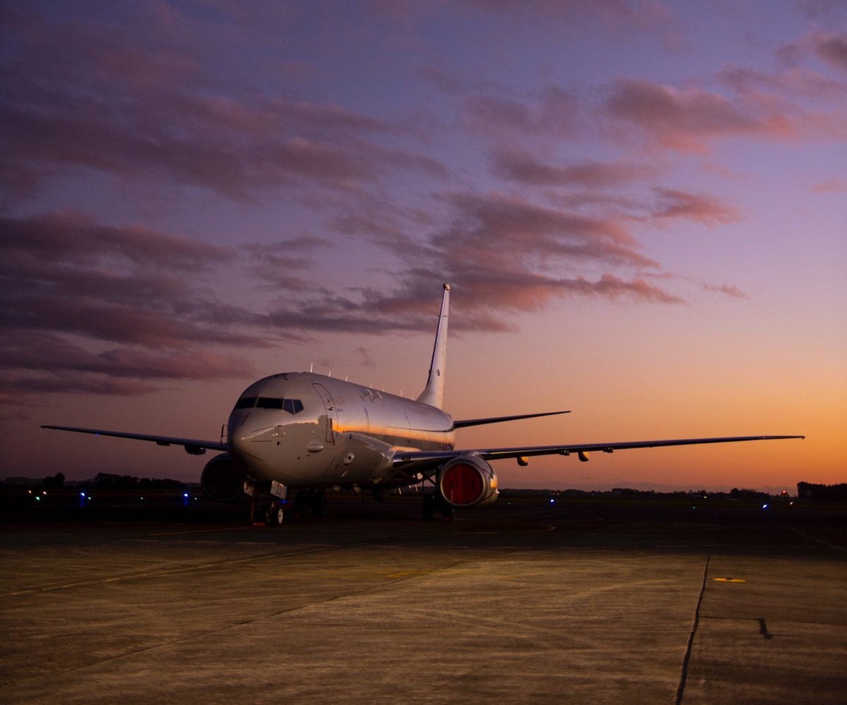 Aircraft on a runway at sunset
